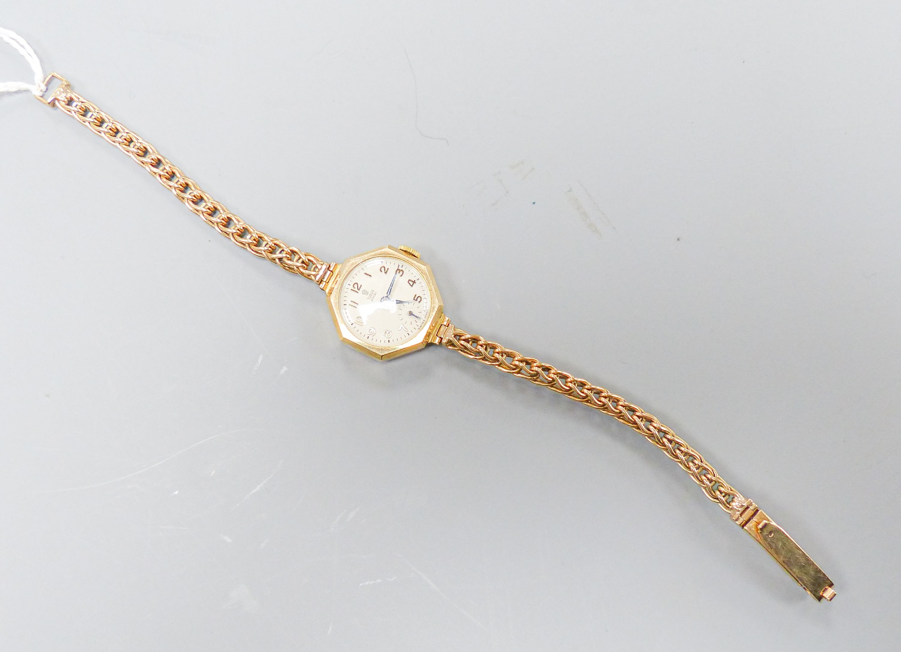 A ladys' vintage Tudor Royal 9ct gold manual wind wristwatch, having circular dial with subsidiary seconds dial in octagonal case, on a 9ct gold flexible link bracelet with safety clasp, in original box